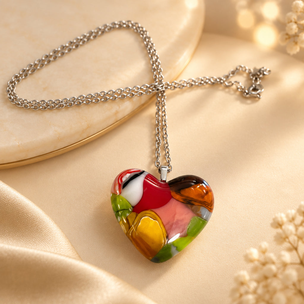 Multicolored patchwork glass heart pendant on a silver-tone chain