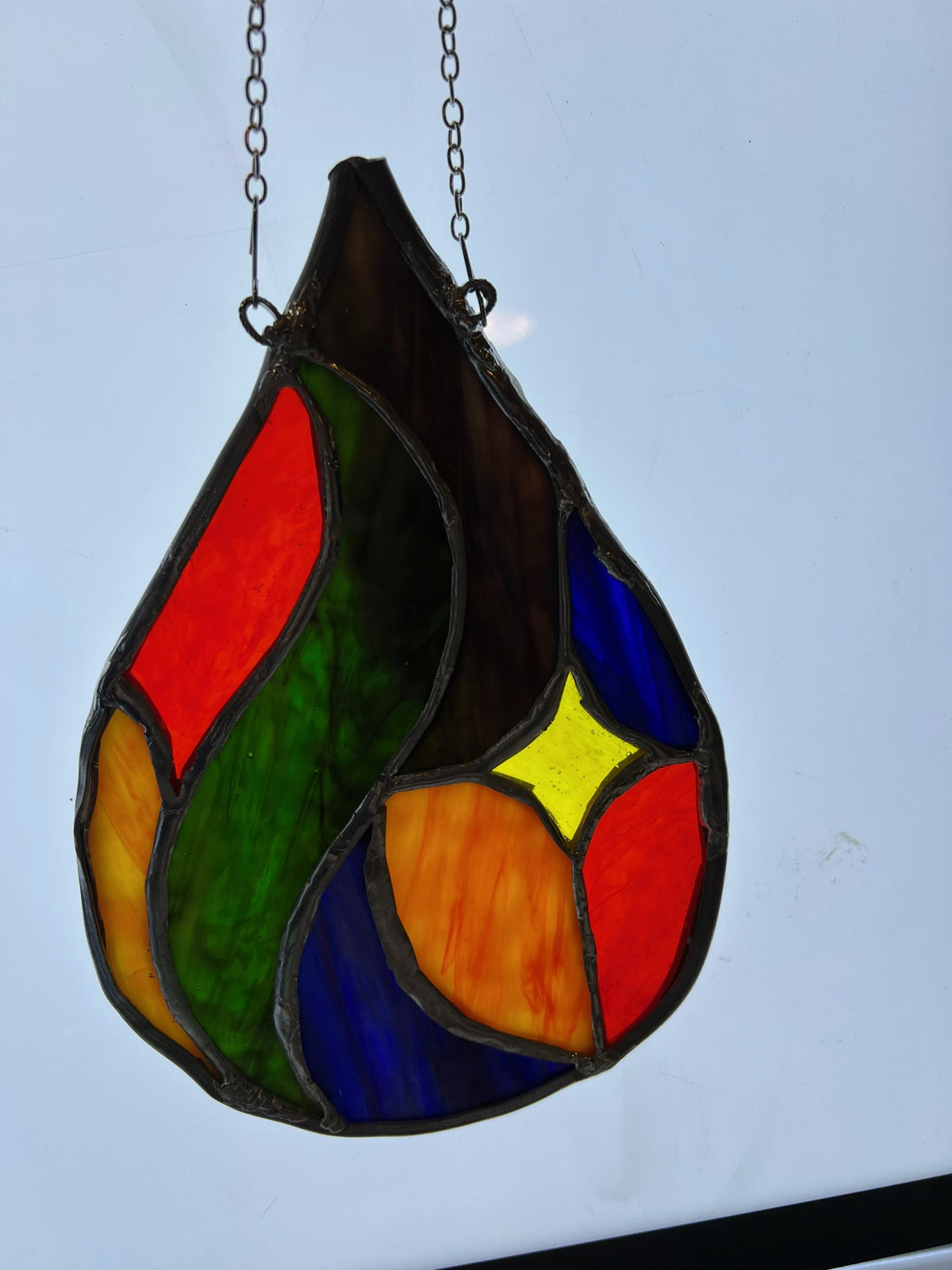 Abstract teardrop stained glass suncatcher, full view