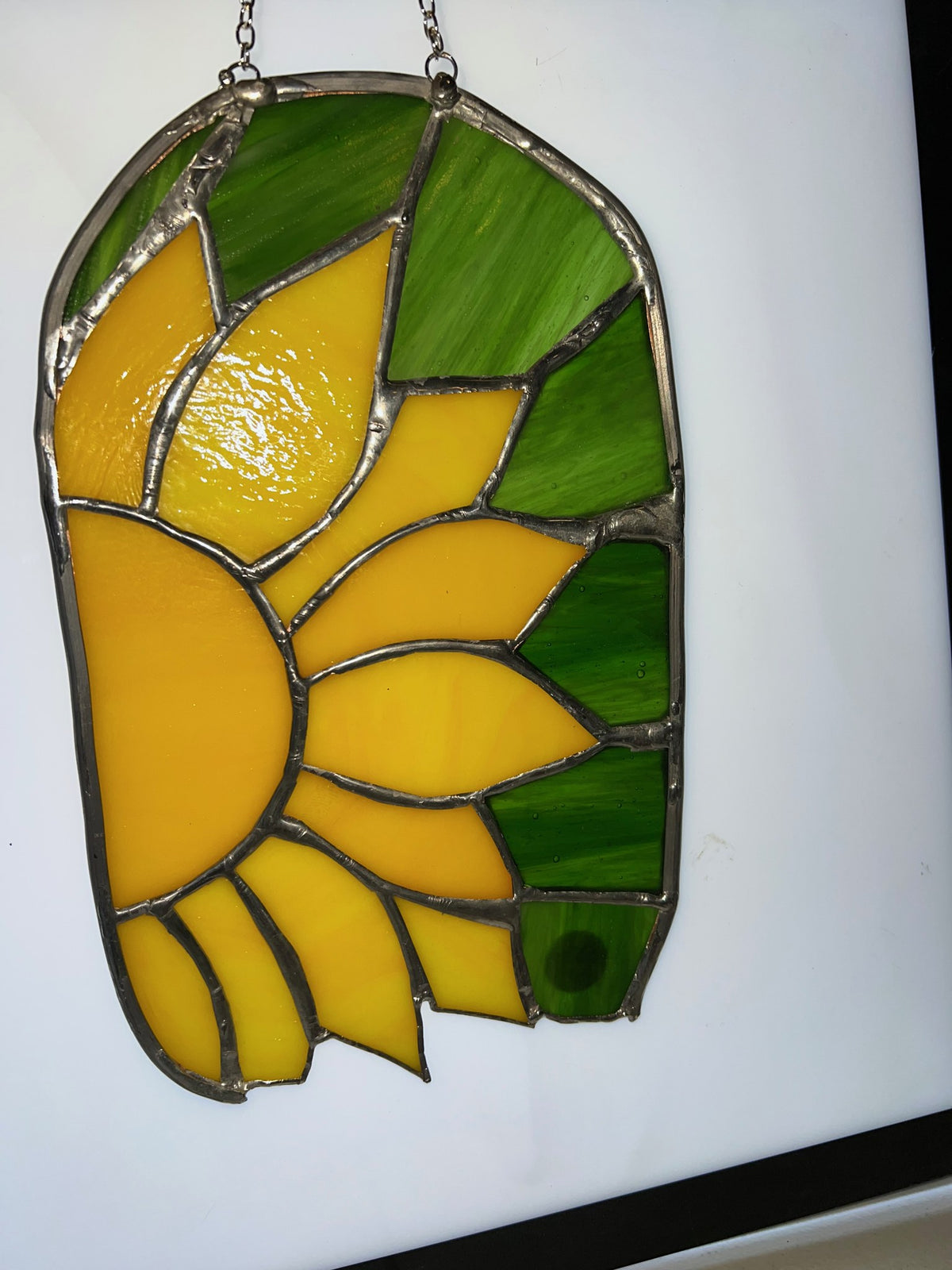 Sunflower bloom stained glass suncatcher, angled view